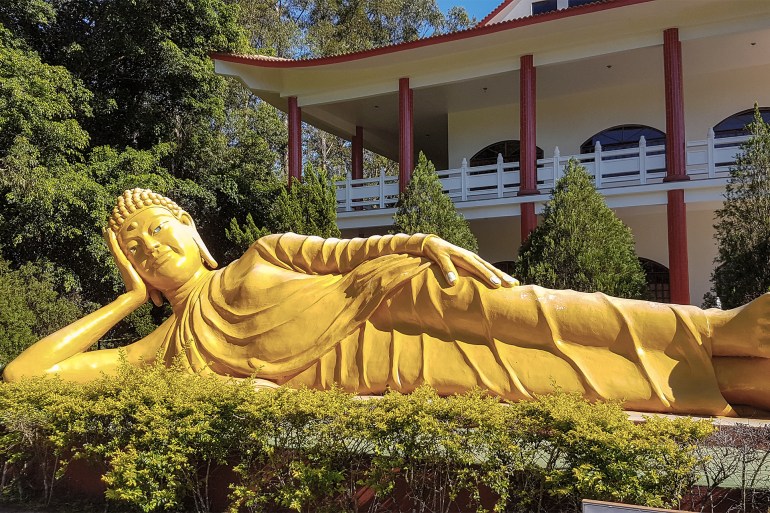 Giant reclining golden Siddharta Gautama Buddha in Chen Tien buddhist temple, Foz do Iguacu, Brazil.