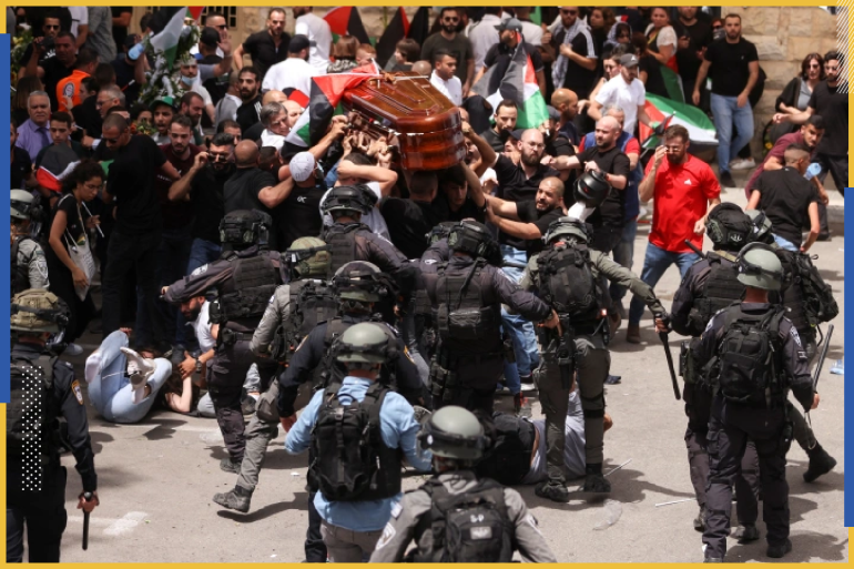 Family and friends carry the coffin of Al Jazeera reporter Shireen Abu Akleh, who was killed during an Israeli raid in Jenin in the occupied West Bank, as clashes erupted with Israeli security forces, during her funeral in Jerusalem, May 13, 2022. REUTERS/Ammar Awad (REUTERS)