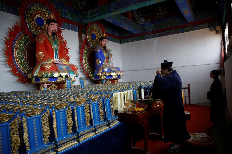 The Wider Image: Taoist priest honours China's coronavirus dead with memorial tablets