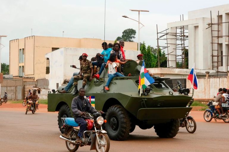 A Russian armored personnel carrier drives in the street during the delivery of armored vehicles to the Central African Republic army in Bangui, Central African Republic, on Oct. 15, 2020. CAMILLE LAFFONT/AFP/GETTY IMAGES