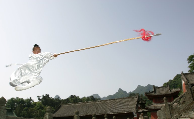 A Taoist performer puts on a show for tourists in Wudang Mountain in Shiyan