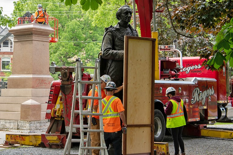 Statue of Canada's first prime minister, Sir John A. MacDonald, is prepared for transport in Kingston