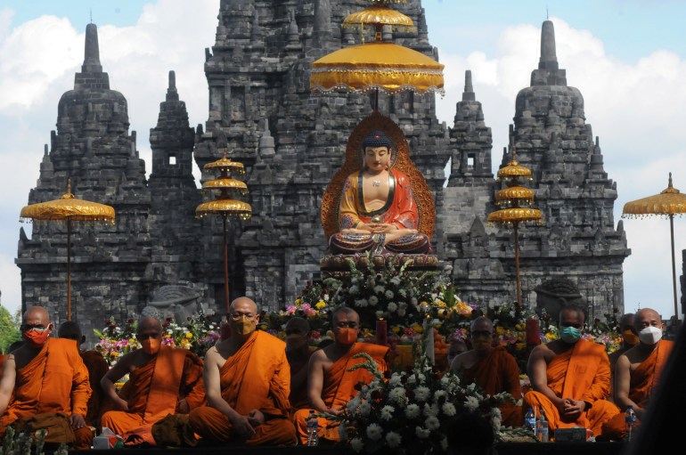 Buddhist monks pray during Vesak Day, an annual celebration of Buddha's birth, enlightenment and death at the Sewu temple in Sleman