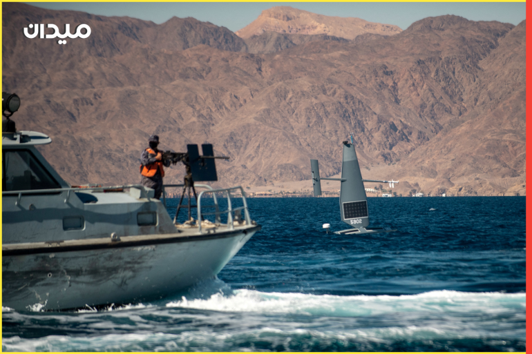 A Saildrone Explorer unmanned surface vessel sails by a Royal Jordanian Navy patrol craft conducting counter illegal fishing training during a 60-nation International Maritime Exercise/Cutlass Express 2022 (IMX/CE22), in the Gulf of Aqaba, Jordan, in this photo taken on February 9, 2022 and released by the U.S. Navy on February 10, 2022, U.S. Naval Forces Central Command/2nd Class Dawson Roth/Handout via REUTERS ATTENTION EDITORS - THIS PICTURE WAS PROVIDED BY A THIRD PARTY