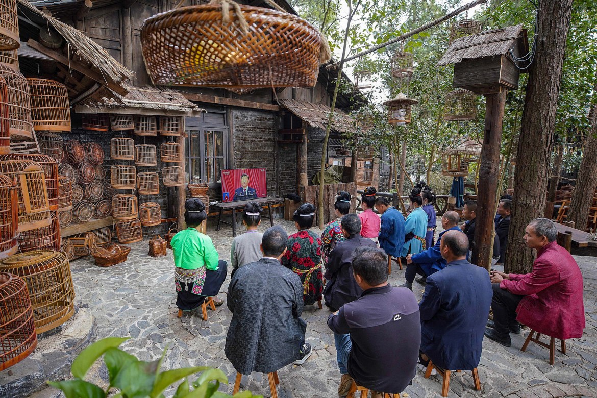 People in Danzhai, in the southwestern Guizhou province, watch the opening session of the Congress. [AFP]
