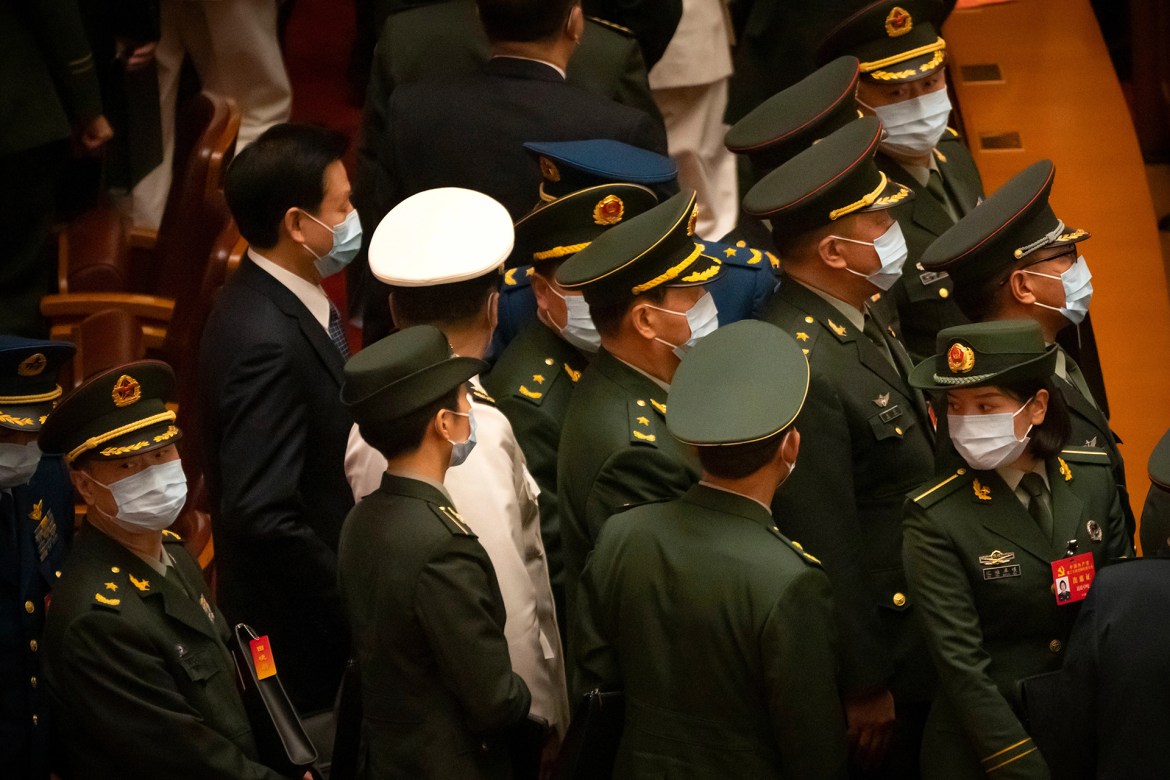 The Congress will also name a Standing Committee, the ruling inner circle of power. The lineup will indicate who is likely to succeed Premier Li Keqiang as the top economic official and take other posts when China's ceremonial legislature meets next year. [Mark Schiefelbein/AP Photo]