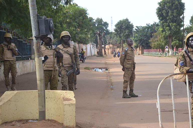 epa10216236 Burkina Faso military close a street in Ouagadougou, Burkina Faso, 30 September 2022. Gunshots have been heard near the presidential palace in Ouagadougou with what some residents claim to be an alleged coup attempt. Access has been blocked by the military to some government buildings including the national assembly and the national broadcaster. In January 2022 the current head of state, Lt-Col Paul-Henri Damiba, ousted President Roch Kabore through a coup. Lieutenant Colonel Paul-Henri Damiba has called for calm. EPA-EFE/ASSANE OUEDRAOGO
