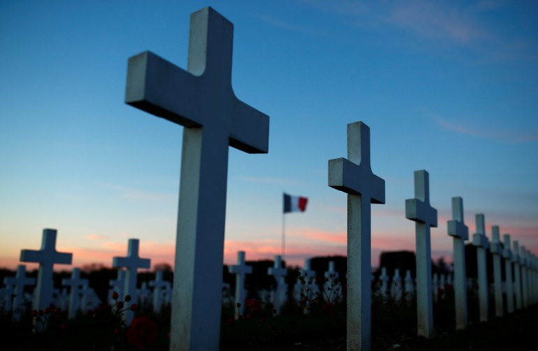 French soldiers tombstones are seen in the early morning light at the cemetery outside the WWI Douaumont Ossuary, as France prepares to mark the centenial commemoration of the First World War Armistice Day, near Verdun, France, November 7, 2018. REUTERS/Christian Hartmann