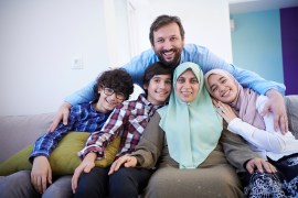 muslim family portrait with arab teenage kids at modern home interior SS1704990859