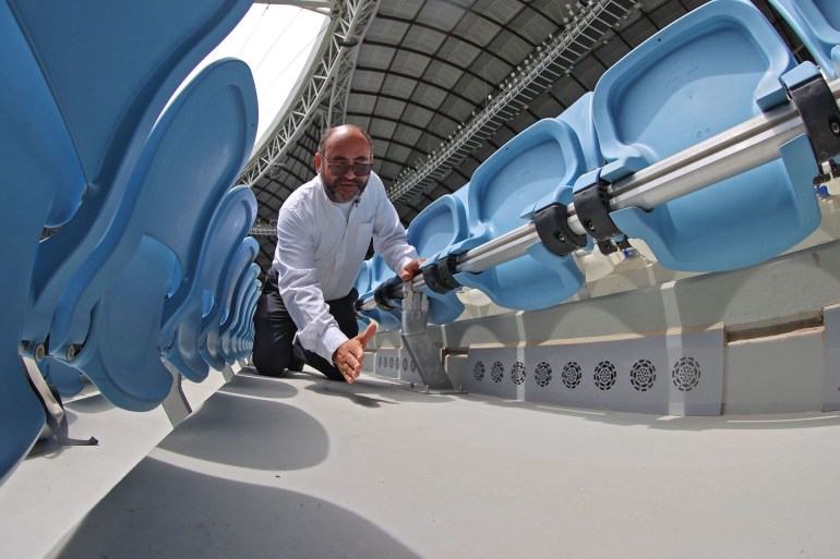 FBL-QAT-WC-2022-STADIUM-AIRCON Saud Abdulaziz Abdul Ghani gives a tour of the cooling system at the al-Janoub Stadium on April 20, 2022 in Doha, which will host matches of the FIFA football World Cup 2022. - Ghani, known as "Dr Cool", worked for 13 years on the solar-powered cooling system that he says will keep the players and turf healthy and even eliminate body odour in a packed stadium. (Photo by KARIM JAAFAR / AFP) (Photo by KARIM JAAFAR/AFP via Getty Images)