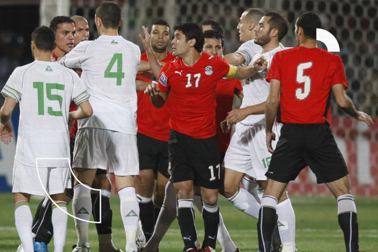 Players argue on the field during the Algeria vs Egypt 2010 World Cup qualifying playoff soccer match in Khartoum November 18, 2009. REUTERS/Amr Abdallah Dalsh (SUDAN SPORT SOCCER)