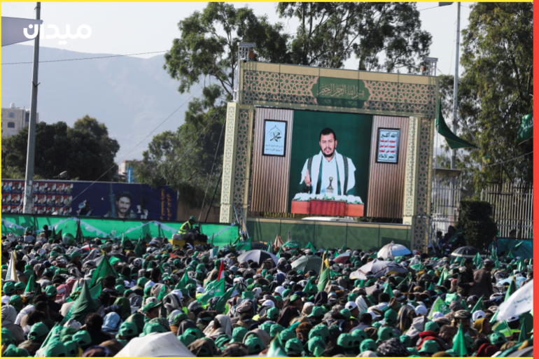 Leader of the Houthi movement Abdul-Malik Badruddin al-Houthi addresses a rally marking the birthday of Prophet Muhammad through a TV screen in Sanaa, Yemen October 8, 2022. REUTERS/Khaled Abdullah