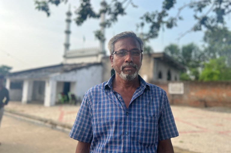 Muhammad Aftab Hussain, 50, associates the recently resurfaced mosque with both his carefree childhood and the displacement he experienced as a teenager when he and his fellow villagers were forced to leave their homes [Rifat Fareed/Al Jazeera]