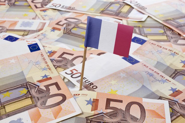 Flag of France sticking in european banknotes.(series)