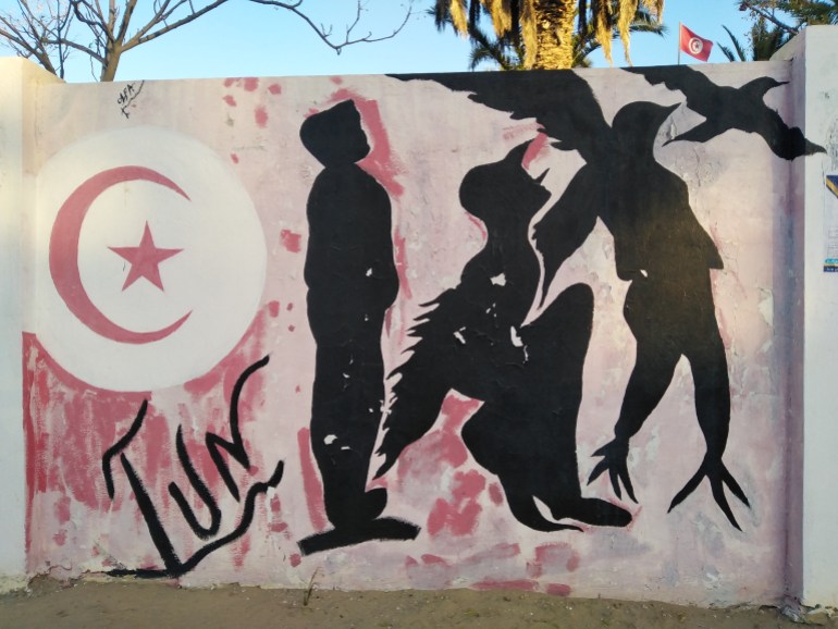 منيرة حجلاوي_إحدى جداريات الثورة في شارع مدينة سيدي بوزيد_تونس_سيدي بوزيد_خاص الجزيرة نت (صورة المراسلة)