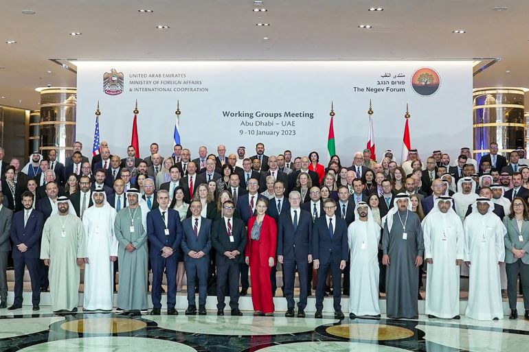 This picture provided by the UAE's Ministry of Foreign Affairs and International Cooperation on January 9, 2023 shows a family photo of the first working groups meeting of the Negev Forum in the UAE capital Abu Dhabi with the participation of the six founding countries the United Arab Emirates, Bahrain, Egypt, Israel, Morocco, and the United States of America. - Arab officials met with Israeli delegates in the United Arab Emirates on January 9 as part of the Negev Forum after a controversial visit by an Israeli minister to Jerusalem's Al-Aqsa mosque compound sparked tensions. Officials from Bahrain, Egypt, Israel, Morocco, the UAE and the US attended the opening session of the Working Groups meeting of the Negev Forum which was born out of normalization deals between Arab states and Israel and aims to strengthen regional cooperation. (Photo by UAE's Ministry of Foreign Affairs and International Cooperation / AFP) / === RESTRICTED TO EDITORIAL USE - MANDATORY CREDIT "AFP PHOTO / HO / UAE MINISTRY OF FOREIGN AFFAIRS AND INTERNATIONAL COOPERATION" - NO MARKETING NO ADVERTISING CAMPAIGNS - DISTRIBUTED AS A SERVICE TO CLIENTS ===