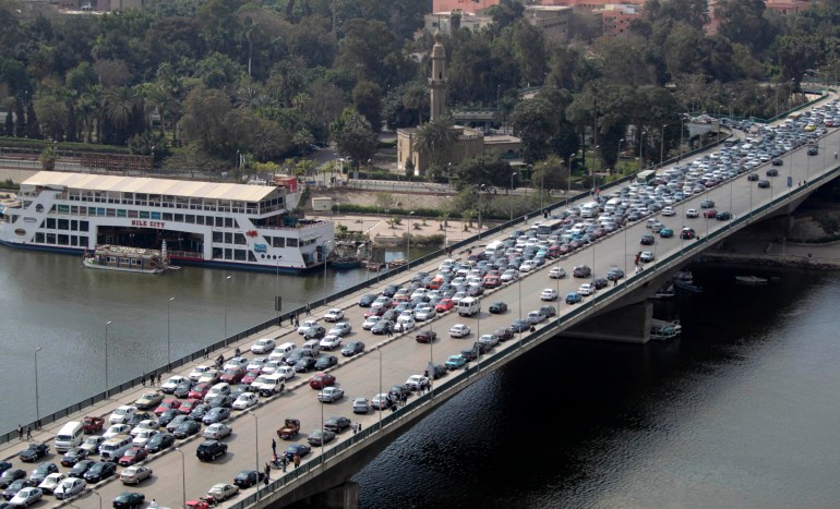 Cars in a traffic jam are seen on a bridge, in Cairo, Egypt, Monday, Jan. 31, 2011. A coalition of opposition groups called for a million people to take to Cairo's streets Tuesday to demand the removal of President Hosni Mubarak. (AP Photo/Lefteris Pitarakis)