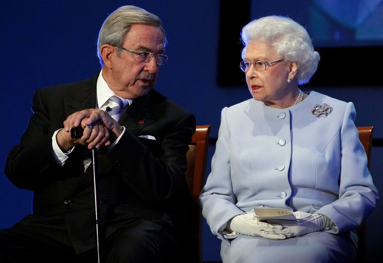 FILE - Britain's Queen Elizabeth II, right, speaks with former King Constantine II during the opening ceremony of the Round Square International Conference at Wellington College, Crowthorne, England, Oct. 17, 2011. Constantine, the former and last king of Greece, has died his doctors announced late Tuesday Jan. 10, 2023. He was 82. (AP Photo/Kirsty Wigglesworth, Pool, File)