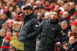 LIVERPOOL, ENGLAND - APRIL 02: Juergen Klopp, Manager of Liverpool and Pepijn Lijnders, Assistant Manager of Liverpool (R) look on during the Premier League match between Liverpool and Watford at Anfield on April 02, 2022 in Liverpool, England. (Photo by Clive Brunskill/Getty Images)