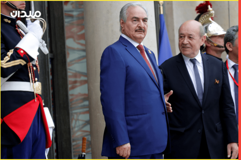 French Foreign Affairs Minister Jean-Yves Le Drian welcomes Khalifa Haftar, the military commander who dominates eastern Libya, as he arrives to attend an international conference on Libya at the Elysee Palace in Paris, France, May 29, 2018. REUTERS/Philippe Wojazer