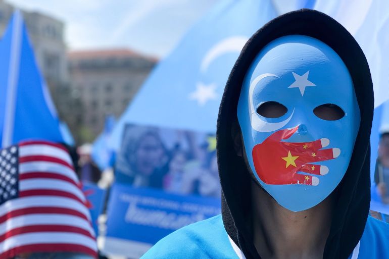 A demonstrator takes part in a protest against China’s human rights abuses against Uighur Muslims, calling on the U.S. government to take action against Beijing, in Washington on April 6, 2019. YASIN OZTURK/ANADOLU AGENCY/GETTY IMAGES