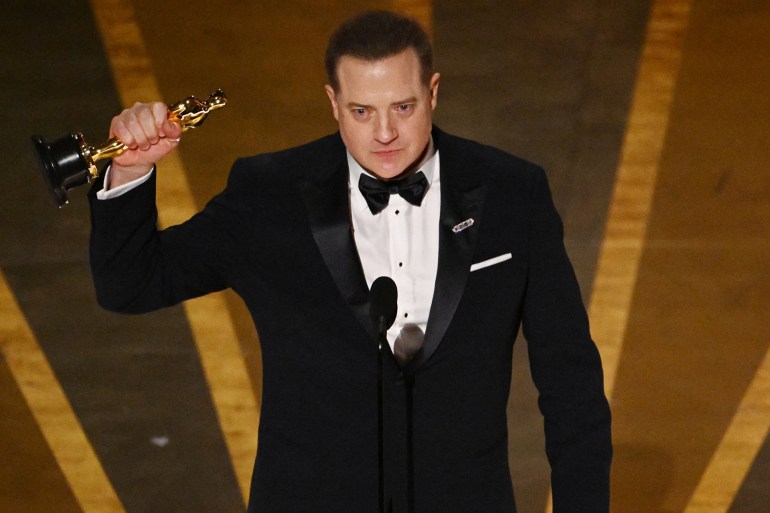 US actor Brendan Fraser accepts the Oscar for Best Actor in a Leading Role for "The Whale" onstage during the 95th Annual Academy Awards at the Dolby Theatre in Hollywood, California on March 12, 2023. (Photo by Patrick T. Fallon / AFP) (Photo by PATRICK T. FALLON/AFP via Getty Images) Brendan Fraser accepts the best actor award for “The Whale.” (Patrick T. Fallon/AFP/Getty Images)