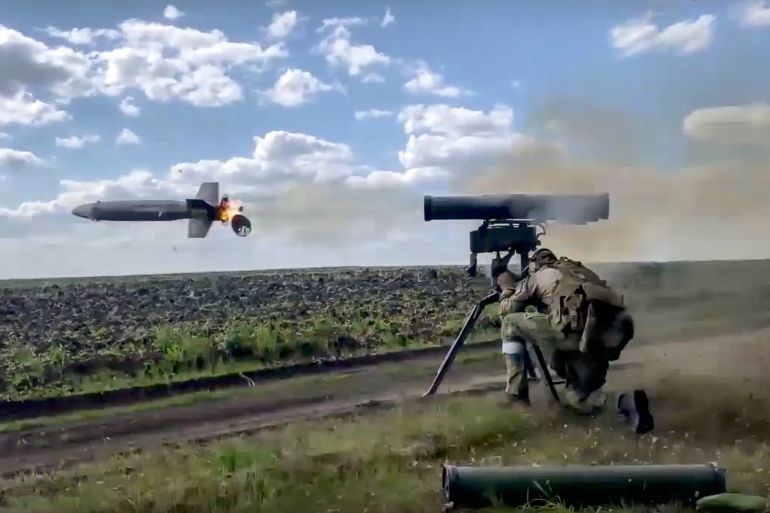In this handout photo taken from video released by Russian Defense Ministry Press Service on Monday, Aug. 29, 2022, a Russian soldier fires from a Kornet, a Russian man-portable anti-tank guided missile on a mission at an undisclosed location in Ukraine. (Russian Defense Ministry Press Service via AP)