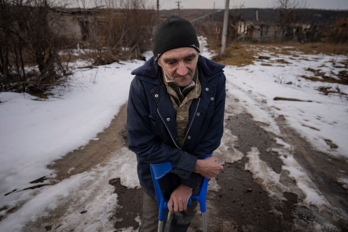 Andrii Cherednichenko, 50, who was injured after stepping on a land mine, speaks during an interview with the Associated Press in his home village of Kamyanka, Ukraine, Sunday, Feb. 19, 2023. In this war-scarred city in Ukraine's northeast, residents scrutinize every step for land mines. The brutality of the Russian invasion in this one-time strategic supply hub for Russian troops counts among the most horrific of the war, which entered its second year last month. (AP Photo/Vadim Ghirda)