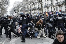 epa10547319 Riot police clash with protesters during a protest against the government's pension reform in Paris, France, 28 March 2023. France faces an ongoing national strike against the government's pensions reform after tthe French prime minister announced on 16 March 2023 the use of Article 49 paragraph 3 (49.3) of the French Constitution to have the text on the controversial pension reform law - raising retirement age from 62 to 64 - be definitively adopted without a vote. EPA-EFE/CHRISTOPHE PETIT TESSON