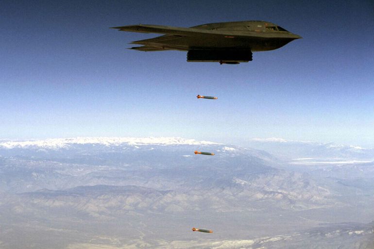 A B-2 drops Joint Direct Attack Munition (JDAM) separation test vehicles over Edwards Air Force Base, credit : California. U.S. Air Force