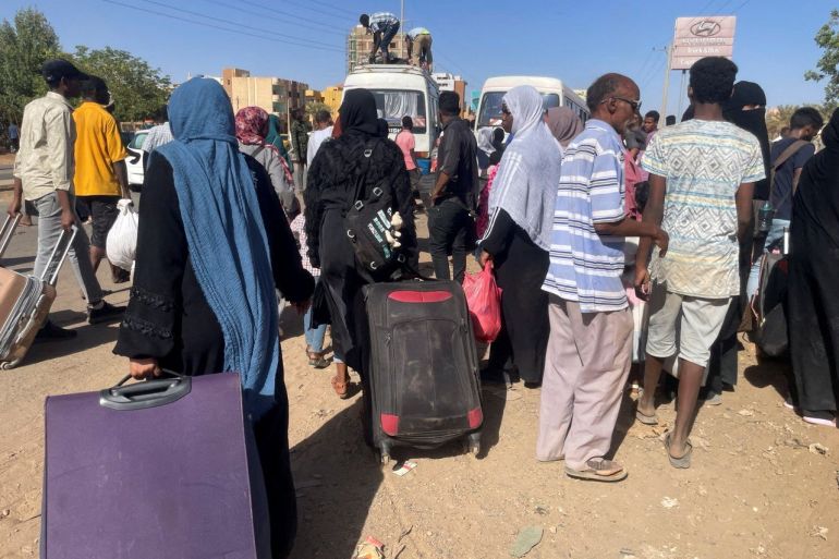 People gather at the station to flee from Khartoum