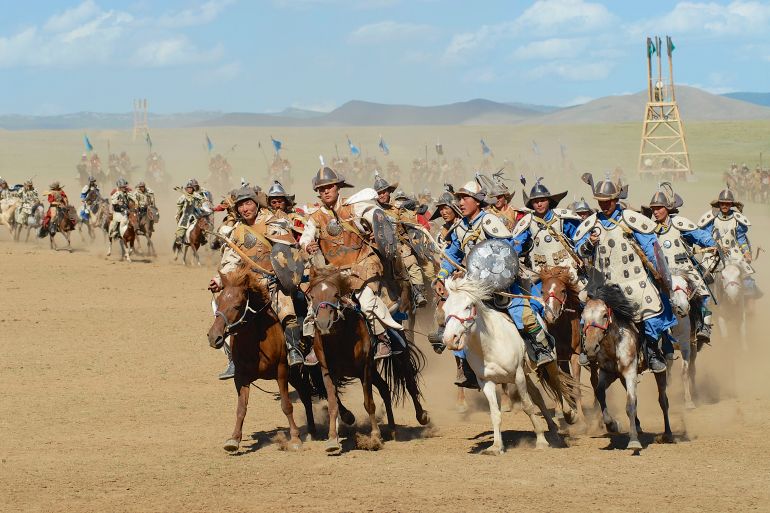 ULAANBAATAR, MONGOLIA - AUGUST 17, 2006: Unidentified Mongolian horse riders take part in the traditional historical show of Genghis Khan era in Ulaanbaatar, Mongolia.