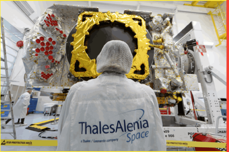 A technician stands in front of the all-electric Konnect communications satellite, which will be shipped to the Guiana Space Center in Kourou, in the clean room facilities at the Thales Alenia Space plant in Cannes, France, November 22, 2019. REUTERS/Eric Gaillard