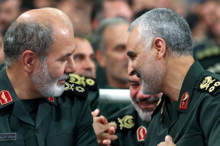 Iran's new Secretary of the Supreme National Security Council Ali Akbar Ahmadian is seen next to the late Iranian Major-General Qasem Soleimani during a meeting in Tehran, Iran, in this undated picture obtained on May 22, 2023. Office of the Iranian Supreme Leader/WANA (West Asia News Agency) via REUTERS ATTENTION EDITORS - THIS IMAGE HAS BEEN SUPPLIED BY A THIRD PARTY.