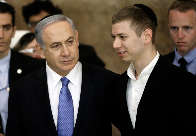 Israeli Prime Minister Benjamin Netanyahu (L) and his son Yair visit, on March 18, 2015, the Wailing Wall in Jerusalem following his party Likud's victory in Israel's general election. Netanyahu swept to a stunning election victory, securing a third straight term for an Israeli leader who has deepened tensions with the Palestinians and infuriated key ally Washington. AFP PHOTO / THOMAS COEX