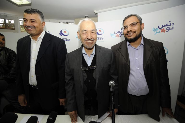 Rached Ghannouchi, the leader of Tunisia's moderate Islamist Ennahda party, arrives for a press conference with his deputies Sahbi Atigue (R) and Fethi Ayadi (L) on March 26, 2012 in Tunis. AFP PHOTO / FETHI BELAID (Photo by FETHI BELAID / AFP)