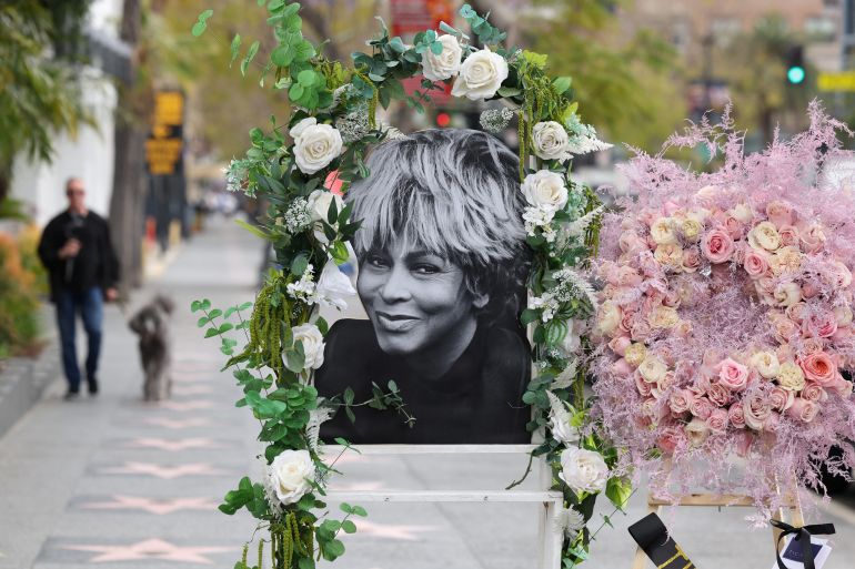 A photograph from late singer Tina Turner adorned with flowers is pictured on the Hollywood Walk of Fame in Los Angeles