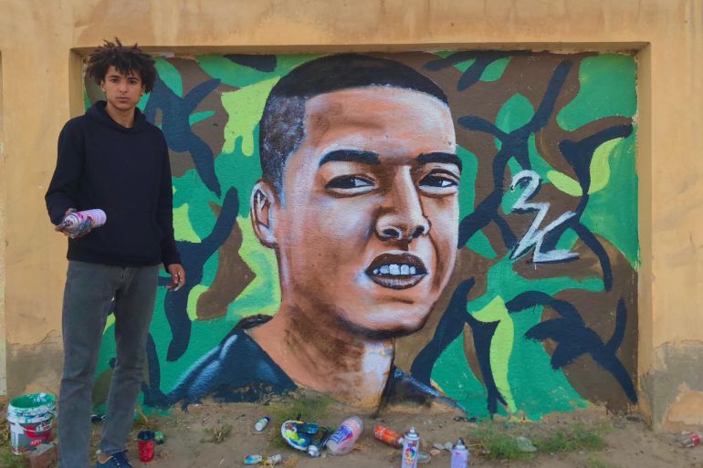 جدارية للمجند الشهيد محمد صلاح في مدينة بلطيم بمحافظة كفر الشيخ من رسم الفنان الشاب كريم خضر