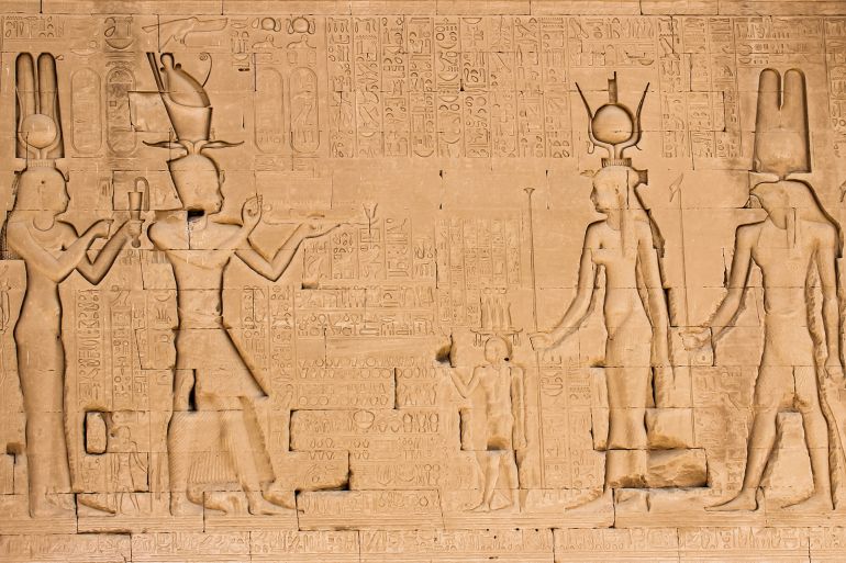 The south wall of the temple of Hathor at Dendera with lion-headed waterspouts. Cleopatra and her son Caesarian (on the left side); Shutterstock ID 517009051; purchase_order: ajnet; job: ; client: ; other: