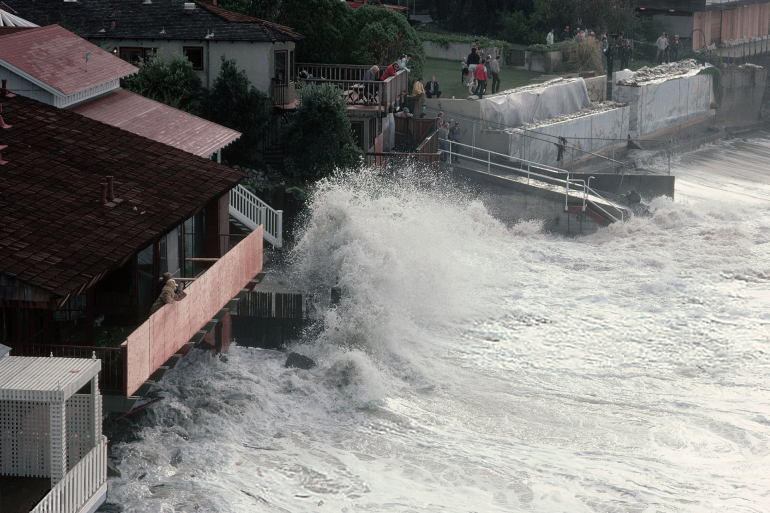 Waves from the El Nino Storm of 1983, batter beach houses on Laguna Beach. California, USA.