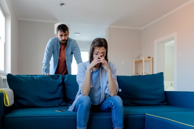 Angry Fury Man Screaming at Woman. Angry Couple Having an Argument in Their Living Room. Young Marriage Couple Have an Argument Because of Relationship Crisis. Couple Having Argument - Conflict, Bad Relationships.