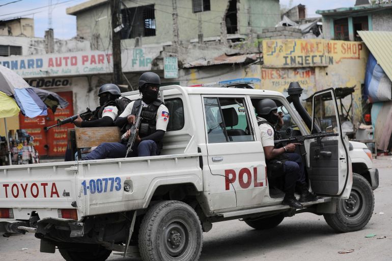 FILE PHOTO: Police patrol the streets after gang members tried to attack a police station, in Port-au-Prince