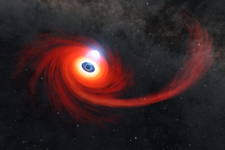 A disk of hot gas swirls around a black hole in this illustration. The stream of gas is what remains of a star that was pulled apart by the black hole. A cloud of hot plasma above the black hole is known as a corona. Credit: NASA/JPL-Caltech
