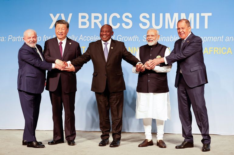 epa10815049 (L-R) President of Brazil Luiz Inacio Lula da Silva, President of China Xi Jinping, South African President Cyril Ramaphosa, Prime Minister of India Narendra Modi and Russia's Foreign Minister Sergei Lavrov pose for a BRICS family photo during the 2023 BRICS Summit at the Sandton Convention Centre in Johannesburg, South Africa, 23 August 2023. South Africa is hosting the 15th BRICS Summit, (Brazil, Russia, India, China and South Africa), as the groups economies account for a quarter of global gross domestic product. Dozens of leaders of other countries in Africa, Asia and the Middle East are also attending the summit. EPA-EFE/GIANLUIGI GUERCIA / POOL