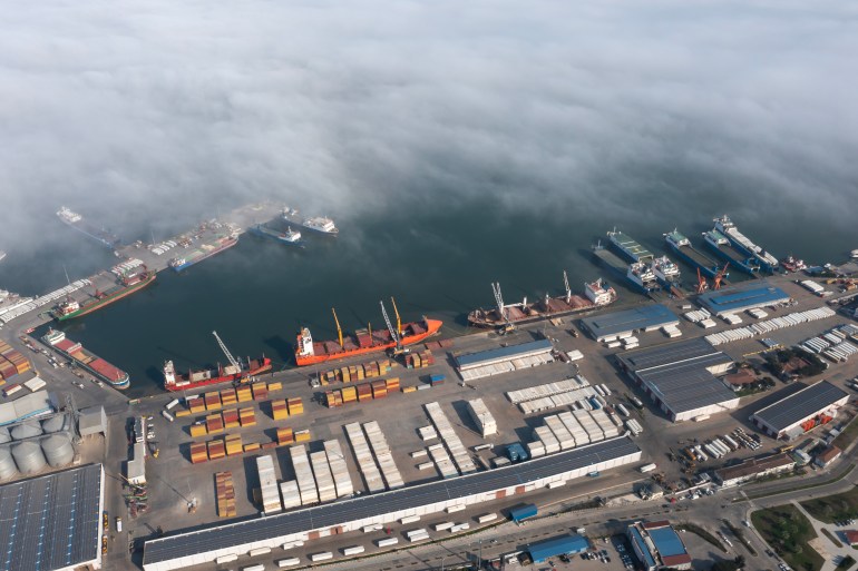 Aerial view of cargo ship terminal in fog