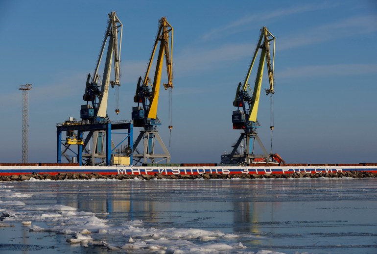 A view shows cranes at the port in the course of Russia-Ukraine conflict in Mariupol, Russian-controlled Ukraine, February 11, 2023. The sign reads: "Mariupol is Russia". REUTERS/Alexander Ermochenko