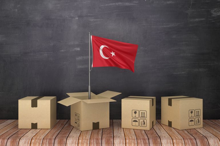 TURKISH Flag in Cardboard Box on Chalkboard - 3D Rendering
