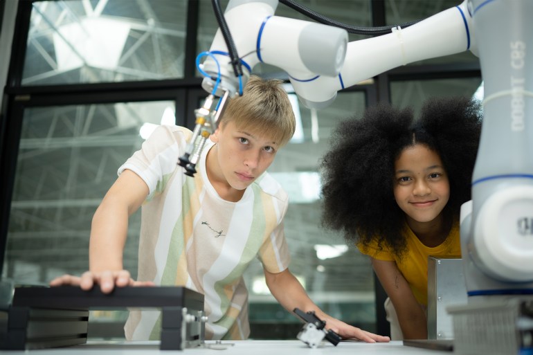 Children using the hand robot technology, Students are studying technology, which is one of the STEM courses. - stock photo