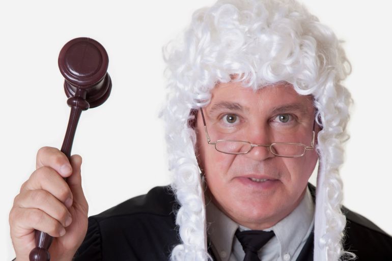 Adult; Gavel; Glasses; Judge; Justice; Law; Male; Mature Adult; Men; One Person; Robe; Wig
