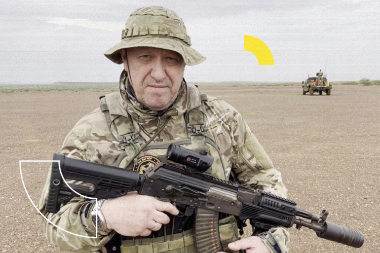 Yevgeny Prigozhin, chief of Russian private mercenary group Wagner, gives an address in camouflage and with a weapon in his hands in a desert area at an unknown location, in this still image taken from video possibly shot in Africa and published August 21, 2023. Courtesy PMC Wagner via Telegram via REUTERS ATTENTION EDITORS - THIS IMAGE WAS PROVIDED BY A THIRD PARTY. NO RESALES. NO ARCHIVES. MANDATORY CREDIT.